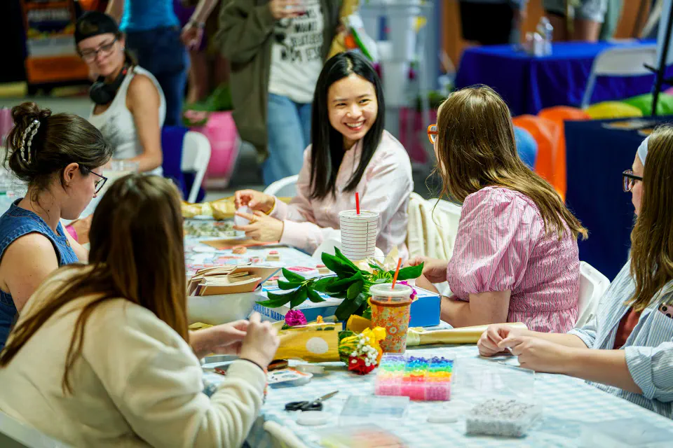 Students talking as they make crafts